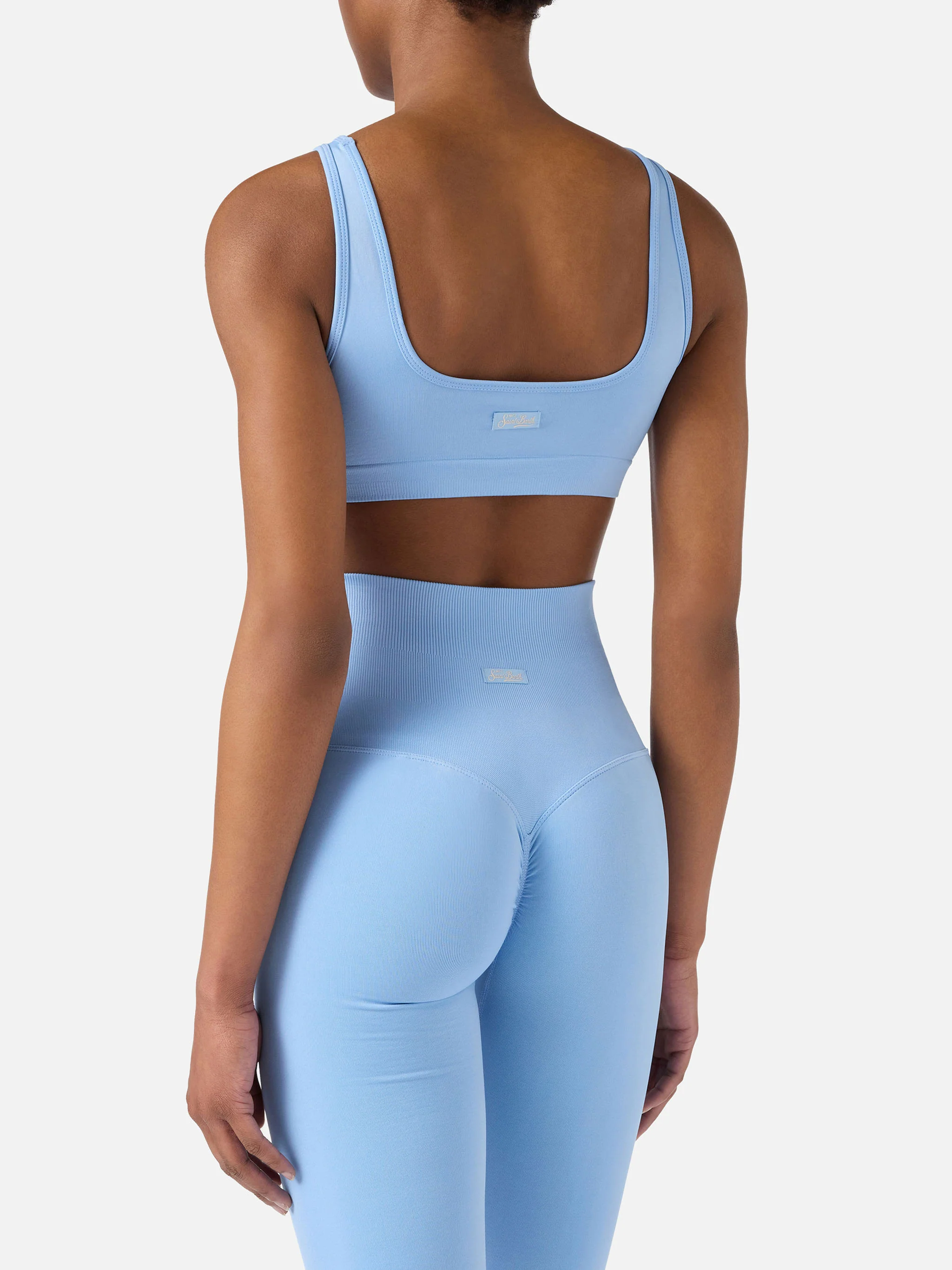 Top sportivo Fify azzurro in tessuto tecnico  con profili a contrasto - Image 4